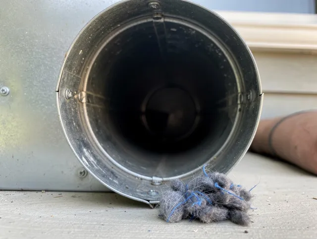 Hamden Dryer Vent Cleaning technician using specialized equipment to clear severe dryer vent blockage in Hamden